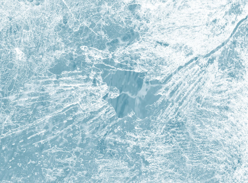 Ice surface texture macro shot on a blue backgrond wallpaper